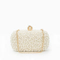 Pearl-embellished clasp clutch with chain strap