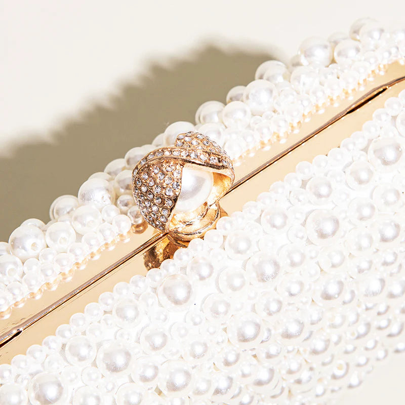 Pearl-embellished clasp clutch with chain strap