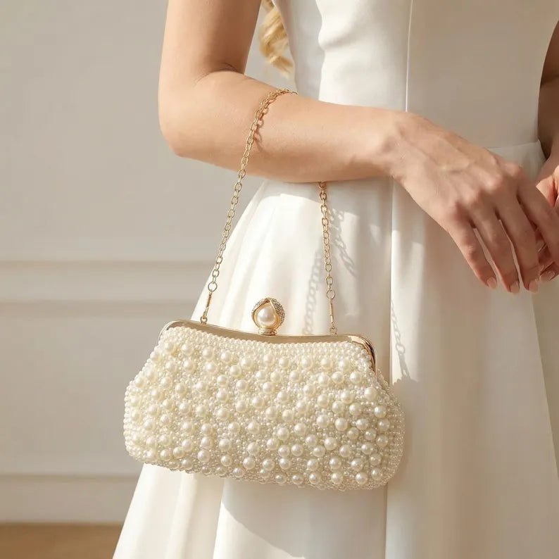Ivory satin bridal clutch with pearl and bead tassels.