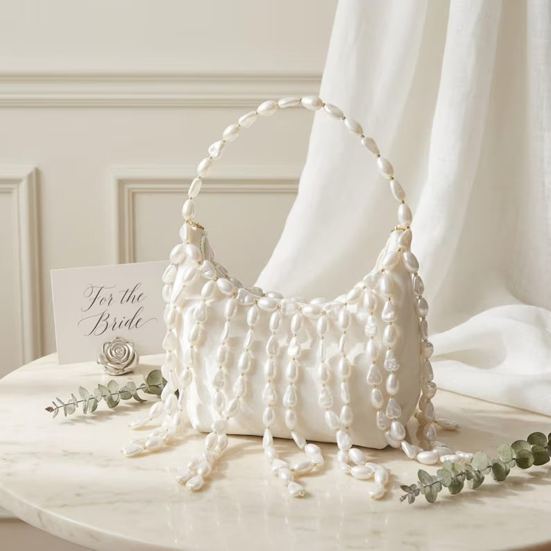 Ivory pearl-embellished evening bag